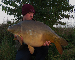 Ben Hutt with one of the smaller residents of the French lake at 28lb.
