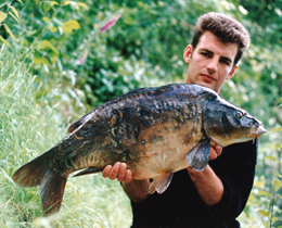 Feature on South Aller quarry pond in Devon by Andrew van Koutrik